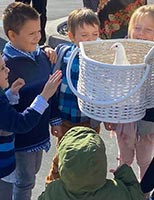 kids watching a dove up close